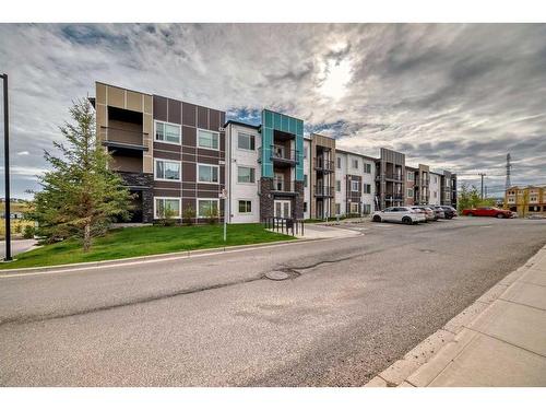 210-8 Sange  Hill Terrace Nw, Calgary, AB - Outdoor With Balcony With Facade