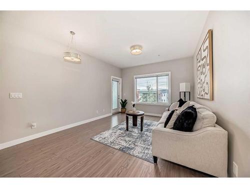 210-8 Sange  Hill Terrace Nw, Calgary, AB - Indoor Photo Showing Living Room