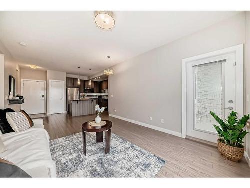 210-8 Sange  Hill Terrace Nw, Calgary, AB - Indoor Photo Showing Living Room