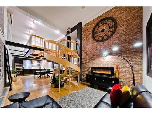 110-1117 1 Street Sw, Calgary, AB - Indoor With Fireplace