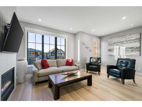 158 Discovery Drive Sw, Calgary, AB - Indoor Photo Showing Living Room With Fireplace