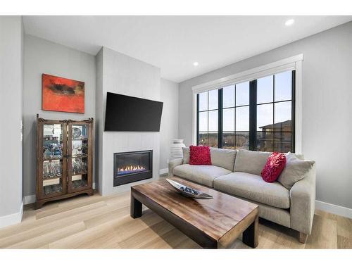 158 Discovery Drive Sw, Calgary, AB - Indoor Photo Showing Living Room With Fireplace