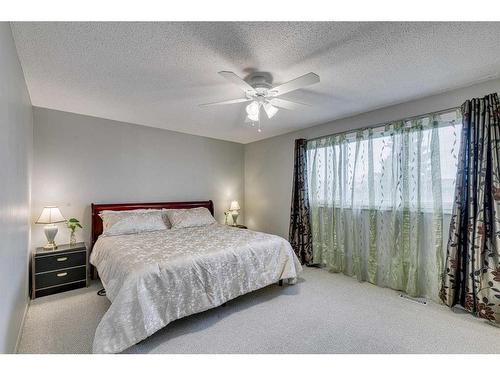 297 Queen Tamara Way Se, Calgary, AB - Indoor Photo Showing Bedroom