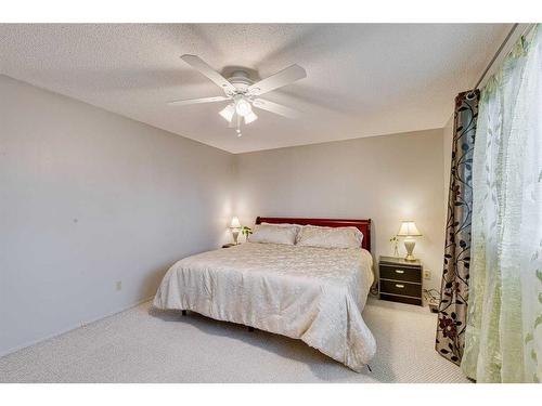 297 Queen Tamara Way Se, Calgary, AB - Indoor Photo Showing Bedroom