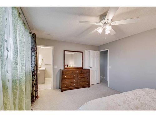 297 Queen Tamara Way Se, Calgary, AB - Indoor Photo Showing Bedroom