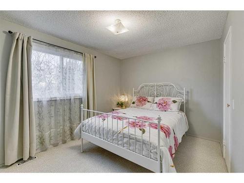 297 Queen Tamara Way Se, Calgary, AB - Indoor Photo Showing Bedroom