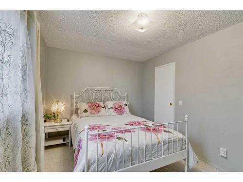 297 Queen Tamara Way Se, Calgary, AB - Indoor Photo Showing Bedroom