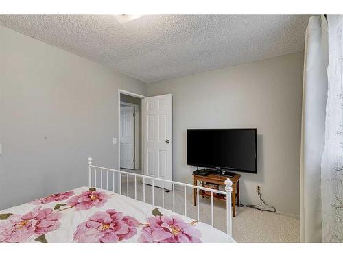 297 Queen Tamara Way Se, Calgary, AB - Indoor Photo Showing Bedroom