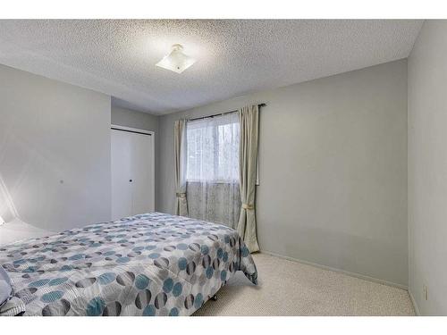 297 Queen Tamara Way Se, Calgary, AB - Indoor Photo Showing Bedroom