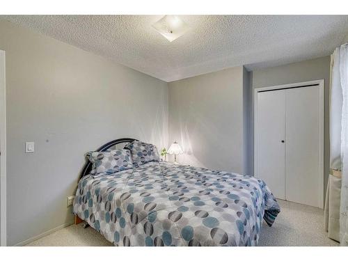 297 Queen Tamara Way Se, Calgary, AB - Indoor Photo Showing Bedroom