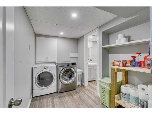 297 Queen Tamara Way Se, Calgary, AB - Indoor Photo Showing Laundry Room