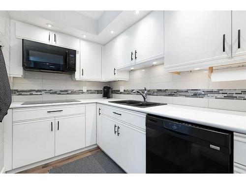 905-1100 8 Avenue Sw, Calgary, AB - Indoor Photo Showing Kitchen With Double Sink