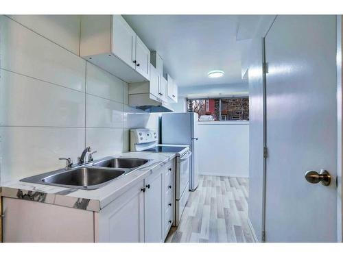 3723 7 Avenue Nw, Calgary, AB - Indoor Photo Showing Kitchen With Double Sink