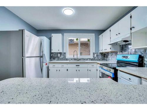 3723 7 Avenue Nw, Calgary, AB - Indoor Photo Showing Kitchen With Double Sink