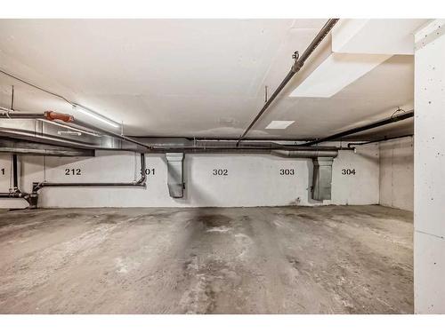 302-1712 38 Street Se, Calgary, AB - Indoor Photo Showing Garage