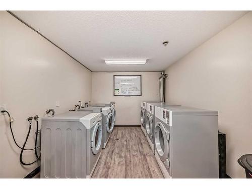 302-1712 38 Street Se, Calgary, AB - Indoor Photo Showing Laundry Room