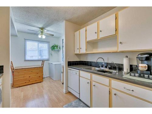 108-15403 Deer Run Drive Se, Calgary, AB - Indoor Photo Showing Kitchen With Double Sink