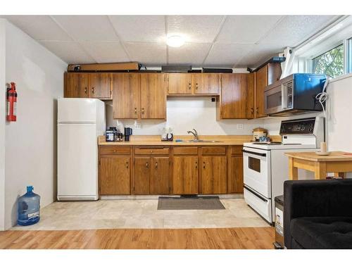 4304 58 Street Ne, Calgary, AB - Indoor Photo Showing Kitchen With Double Sink