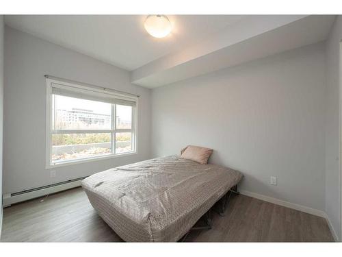 113-4150 Seton Drive Se, Calgary, AB - Indoor Photo Showing Bedroom