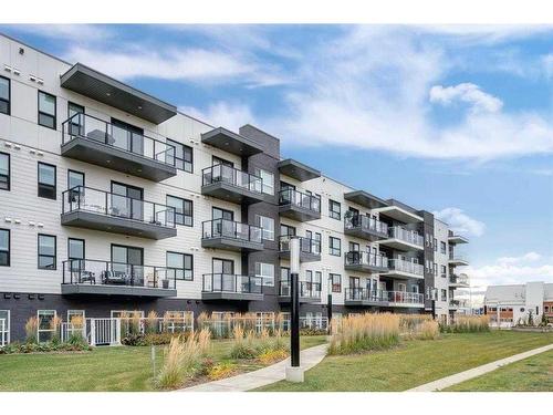 113-4150 Seton Drive Se, Calgary, AB - Outdoor With Balcony With Facade