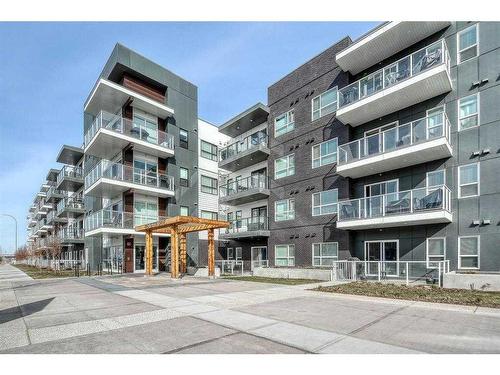 113-4150 Seton Drive Se, Calgary, AB - Outdoor With Balcony With Facade