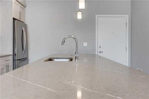 113-4150 Seton Drive Se, Calgary, AB - Indoor Photo Showing Kitchen