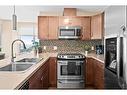 2502-1320 1 Street Se, Calgary, AB  - Indoor Photo Showing Kitchen With Double Sink 