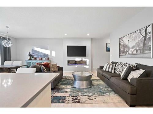 109 Belmont Terrace Sw, Calgary, AB - Indoor Photo Showing Living Room With Fireplace