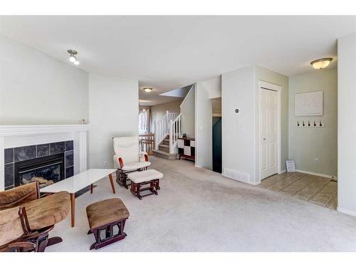 18 Covewood Circle Ne, Calgary, AB - Indoor With Fireplace