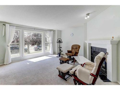 18 Covewood Circle Ne, Calgary, AB - Indoor Photo Showing Living Room With Fireplace