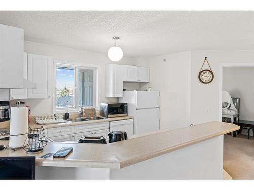 2301-20 Harvest Rose Park Ne, Calgary, AB - Indoor Photo Showing Kitchen With Double Sink