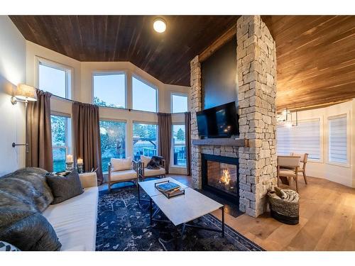 251 Gleneagles View, Cochrane, AB - Indoor Photo Showing Living Room With Fireplace