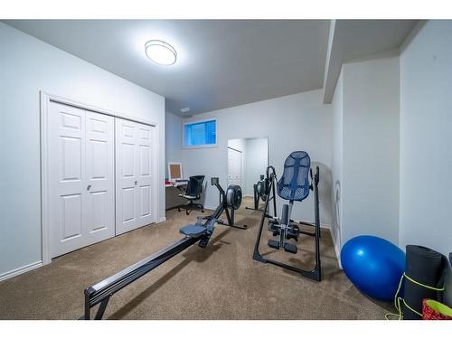 251 Gleneagles View, Cochrane, AB - Indoor Photo Showing Gym Room