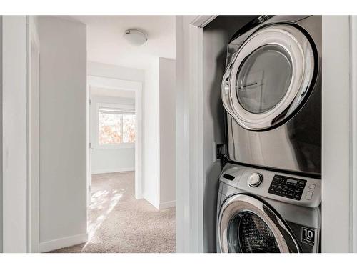 87 West Coach Manor Sw, Calgary, AB - Indoor Photo Showing Laundry Room