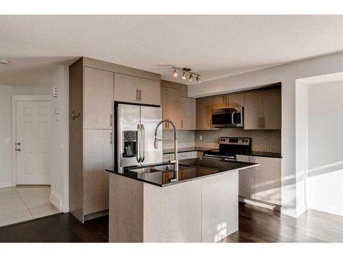 87 West Coach Manor Sw, Calgary, AB - Indoor Photo Showing Kitchen With Stainless Steel Kitchen With Double Sink