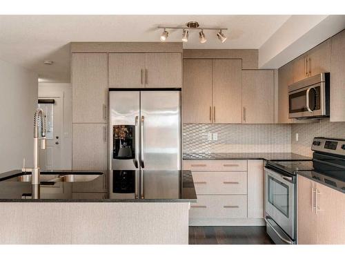 87 West Coach Manor Sw, Calgary, AB - Indoor Photo Showing Kitchen With Stainless Steel Kitchen With Upgraded Kitchen