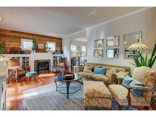 6003 Lloyd Crescent Sw, Calgary, AB - Indoor Photo Showing Living Room With Fireplace