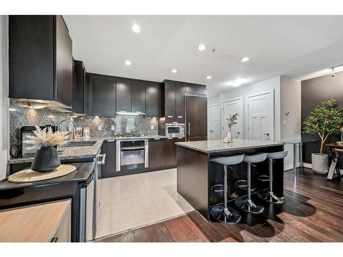 132-99 Spruce Place Sw, Calgary, AB - Indoor Photo Showing Kitchen With Upgraded Kitchen