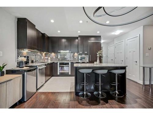 132-99 Spruce Place Sw, Calgary, AB - Indoor Photo Showing Kitchen With Upgraded Kitchen