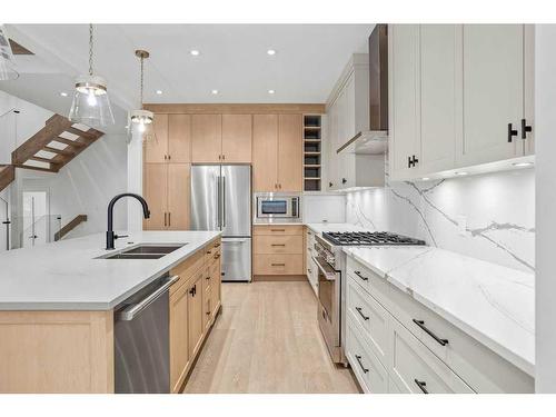 251B Three Sisters Drive, Canmore, AB - Indoor Photo Showing Kitchen With Double Sink With Upgraded Kitchen