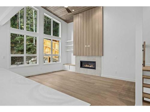 251B Three Sisters Drive, Canmore, AB - Indoor Photo Showing Living Room With Fireplace