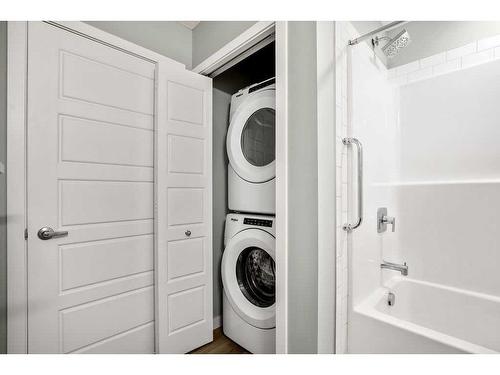 107-1605 17 Street Se, Calgary, AB - Indoor Photo Showing Laundry Room