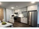 1313-350 Livingston Common Ne, Calgary, AB  - Indoor Photo Showing Kitchen With Stainless Steel Kitchen With Upgraded Kitchen 