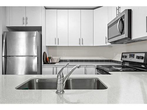 4118-181 Skyview Ranch Manor Ne, Calgary, AB - Indoor Photo Showing Kitchen With Stainless Steel Kitchen With Double Sink