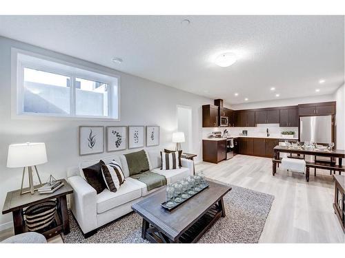 164 Setonstone Manor Se, Calgary, AB - Indoor Photo Showing Living Room