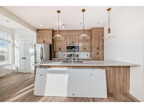 45 Shale Avenue, Cochrane, AB - Indoor Photo Showing Kitchen With Upgraded Kitchen