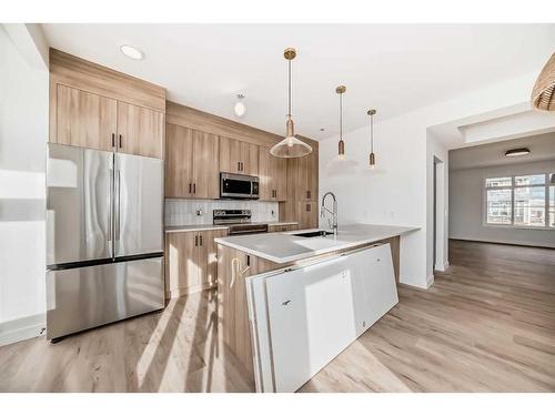 45 Shale Avenue, Cochrane, AB - Indoor Photo Showing Kitchen With Upgraded Kitchen