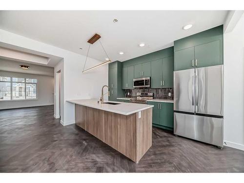 57 Shale Avenue, Cochrane, AB - Indoor Photo Showing Kitchen With Upgraded Kitchen