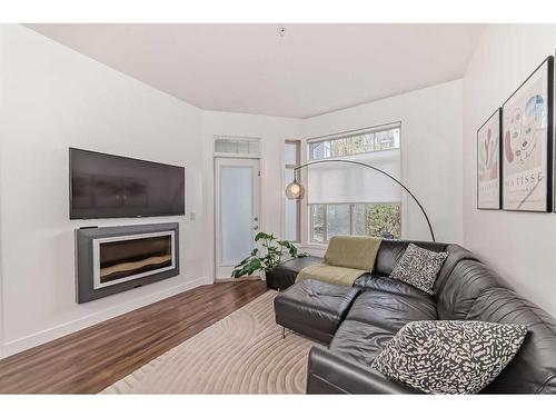 110-16 Auburn Bay Link Se, Calgary, AB - Indoor Photo Showing Living Room