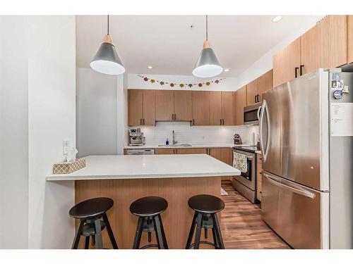 110-16 Auburn Bay Link Se, Calgary, AB - Indoor Photo Showing Kitchen With Stainless Steel Kitchen